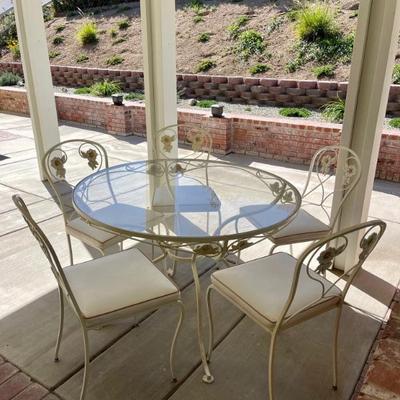 Outdoor patio set . White cushions weather proof 
Rod iron 1950â€™s 