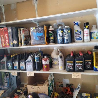 A wall of cleaners and oils