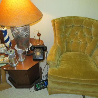 Cute vintage living room chair ( It's part of a perfect pair), vintage octagon table, decor lamp & vintage rotary phone.