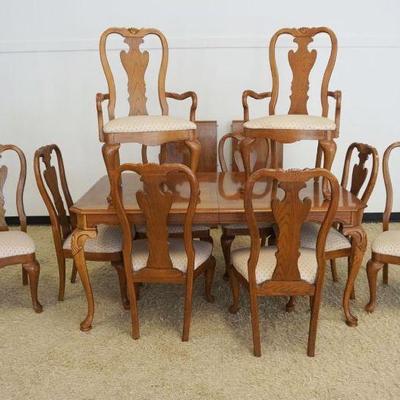 1181	THOMASVILLE SOLID OAK QUEEN ANNE STYLE TABLE W/2 LEAVES & 10 CHAIRS, 8 SIDE, 2 ARM, TABLE APPROXIMATELY 68 IN X 43 IN X 30 IN HIGH,...