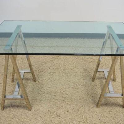 1245	RESTORATION HARDWARE MODERN GLASS TOP TABLE W/TWIN CHROME SAW HORSE BASE, APPROXIMATELY 60 IN X 36 IN X 31 IN HIGH
