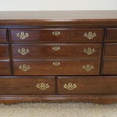1196A	CHEST OF DRAWERS WITH CHERRY FINISH, HAVING 8 DRAWERS, APPROXIMATELY 63 IN X 18 IN X 32 IN
