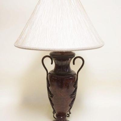 1117	TABLE LAMP IN THE FORM OF A DOUBLE HANDLED URN W/A BRONZE FINISH
