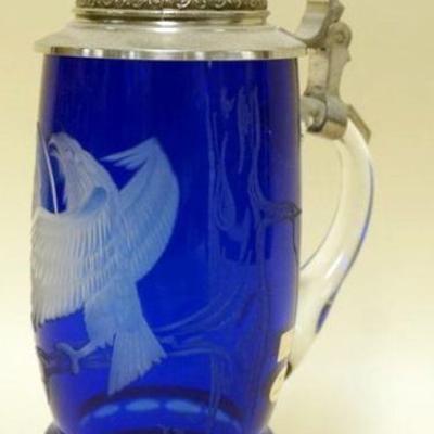 1057	BAVARIAN CRYSTAL COLBALT BLUE ETCHED GLASS STEIN JEWELED PEWTER LID, APPROXIMATELY 9 IN H. SIGNED & NUMBERED
