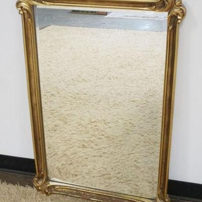 1269	HANGING BEVELED EDGE MIRROR IN GILT FINISHED FRAME, APPROXIMATELY 25 IN X 38 IN
