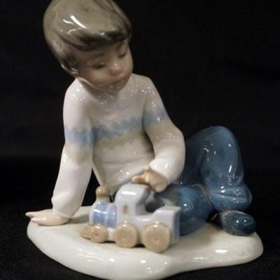 1012	NAO PORCELAIN FIGURINE, BOY PLAYING W/TRAIN, APPROXIMATELY 5 IN HIGH
