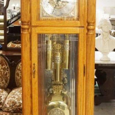 1162	HOWARD MILLER GRANDFATHERS CLOCK, MILLENNIUM EDITION IN SOLID OAK CASE W/BEVELED & ETCHED GLASS, APPROXIMATELY 27 IN X 17 IN X 88 IN...