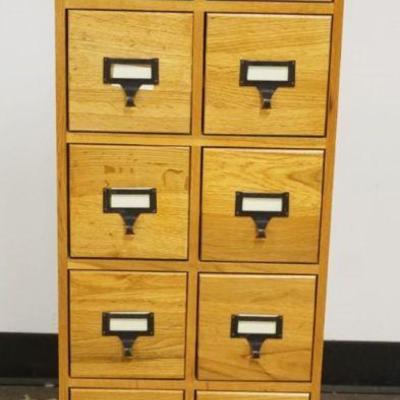 1169	OAK 12 DRAWER CABINET, APPROXIMATELY 15 IN X 7 IN X 40 IN HIGH
