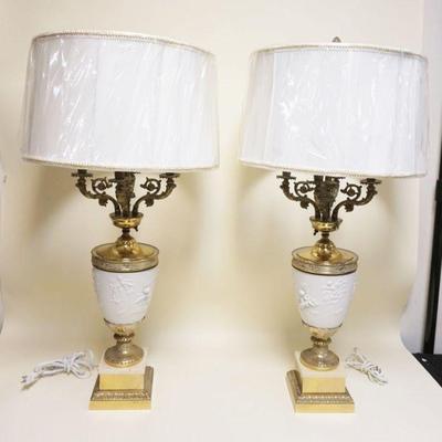 1115	PAIR OF ORNATE BRASS CADELABRA TABLE LAMPS W/PARIAN INSERTS & EMBOSSED CHERUBS, APROXIMATELY 38 IN
