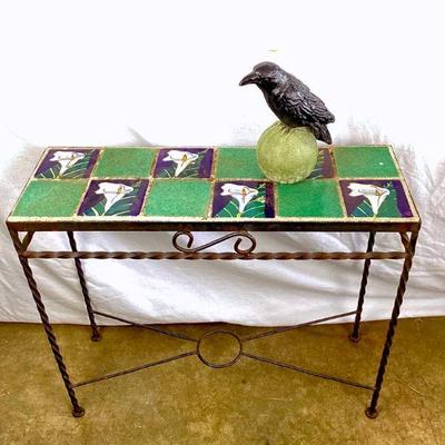 JIFI901 Vintage Wrought Iron Table & Decorative Raven	Floral tile table top sits atop wrought iron base Â measures approximately 25.5'...