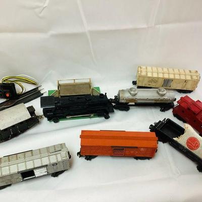 RIHI712 Lionel Electric Trains Collection I	Lot includes: Â Automatic 1940 Dump Car. Operating Cattle Car, and 0 Guage Merchant Car and...