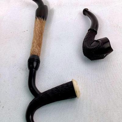 JIFI905 Vintage Smoking Pipes	2 black smoking pipes. Â Measuring approximately 5.5' long & 2.5' long.
