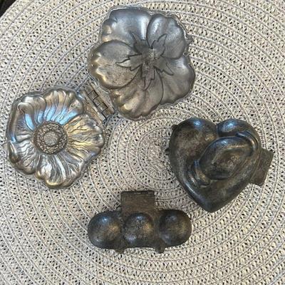 Antique pewter ice cream molds.
Upper Left: Flower (rare). $50
Bottom Center: 3 Balls. $40
Upper Right: Heart with joined hands. $60