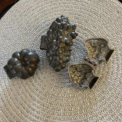 Antique pewter ice cream molds.
Left: Tomato. $35
Center: Grapes. $60
Right: Flowers in basket. $50