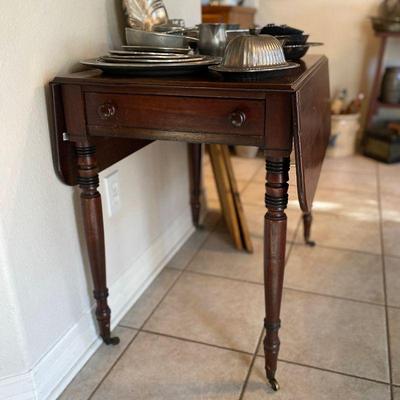 Antique mahogany drop leaf table. Estate sale price: $285
