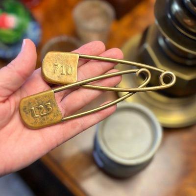 Extra large brass safety pins. Estate sale price: $25 each