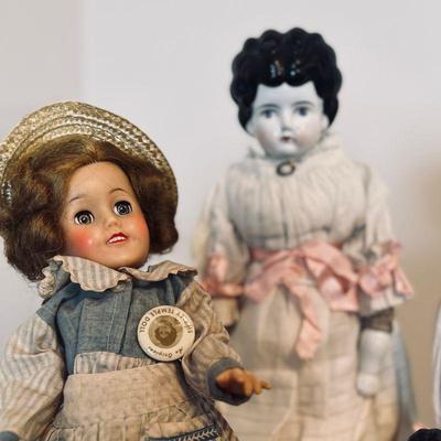 Left: Shirley Temple. $35
Right: Low brow china doll: $65