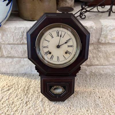 Antique dark wood wall clock. Estate sale price: $150
