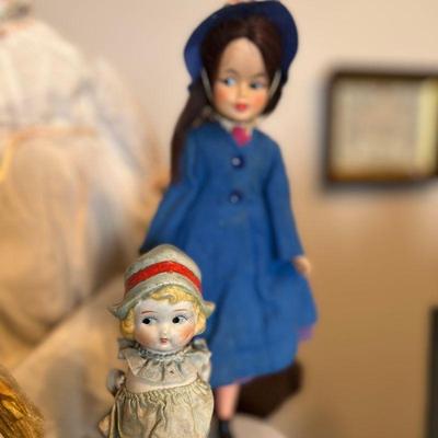 Left doll: $15. 
Right doll: $10