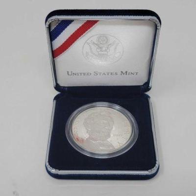 #1404 â€¢ Abraham Lincoln Commemorative Dollar Coin
