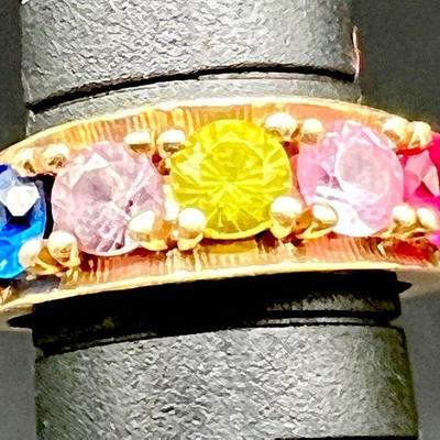 Antique 10K Gold Jewelry Rainbow Ring
Size 5. 10K Yellow Gold ring with five colorful gemstones believed by the collector to be sapphire,...