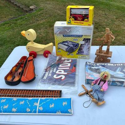 Toy Lot: Spider-Man, Curious George, NASA Space Shuttle, More
Battlebots, Toy Violin, Spider Man, Timberkits Mechanical Wooden Guitarist,...