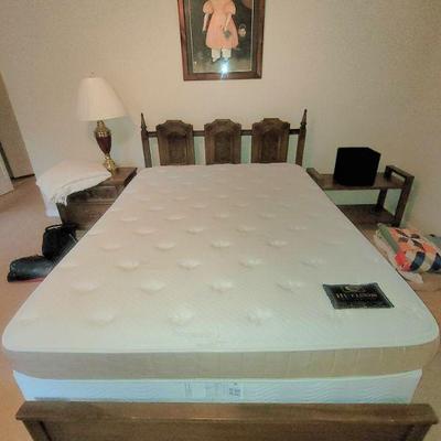 Queen bed with clean mattress and boxsprings