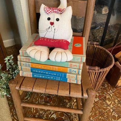 Childs chair, books and cat decoratives