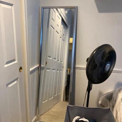 Full length mirror and floor fan
