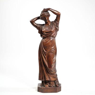 ANTIQUE CARVED WOOD FIGURE | An antique intricately carved wood figure of a woman, no apparent signature. h. 21 in.