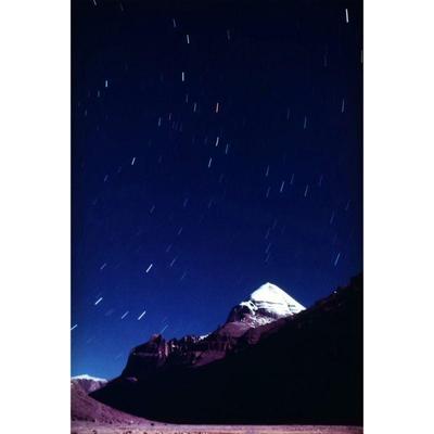 GALEN ROWELL (1940-2002) PHOTOGRAPH | Star Streaks over Mount Kailas. Color print, 1987/94. 19 x 12.5 in. sight. ed 17/300, signed on the...