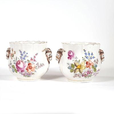 PAIR PORCELAIN CACHE POTS | Hand painted with flowers and with Ramshead mounts, with indistinct blue underglaze mark on bottoms - w. 6.5...