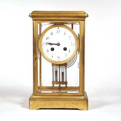 TIFFANY & CO. FRENCH SHELF CLOCK | Samuel Marti, having a white dial with painted enamel Arabic numeral markers, in a gilt bronze case...