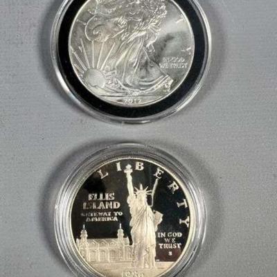 (1) 2012 Silver Eagle 31.1 Grams, (1) 1986 Statue of Liberty Commemorative 90% Silver 26.73 Grams
