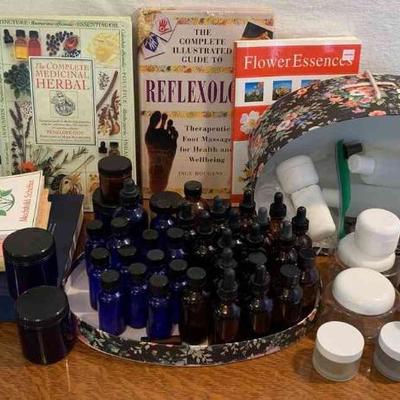 Herbal books with small glass bottles and lids