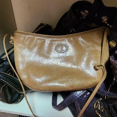 Lot 54 - Ladies' Closet Lot (12/Large - clothes, purses, and other accessories) 