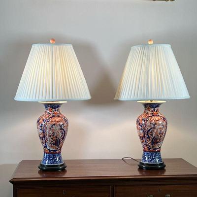 (2PC) IMARI PORCELAIN BALUSTER VASE LAMPS | Red and blue Imari baluster vases drilled and mounted as lamps on round wooden base. - h. 32...