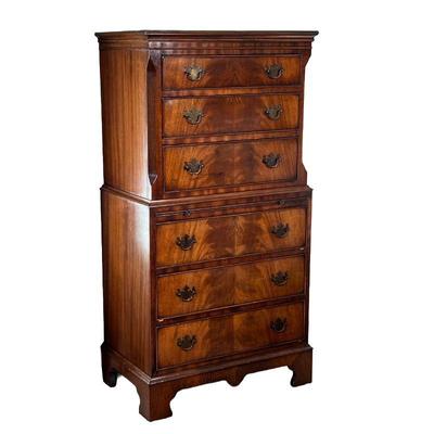 GEORGE III STYLE FLAME MAHOGANY CHEST ON CHEST | Diminutive chest on chest, having six drawers with a medial molding, canted corners,...