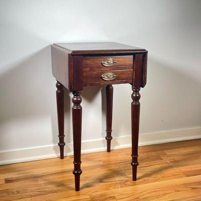 ANTIQUE DROP LEAF SIDE TABLE | Small drop leaf side table with 2 small drawers with brass bulls over spindle carved legs. Leaf length: 7...