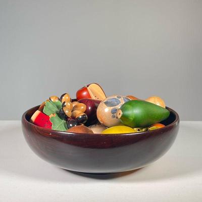 CARVED WOOD FRUIT & VEGETABLE BOWL | Turned wood bowl filled with painted and carved wood fruit and vegetables including: grapes, an...