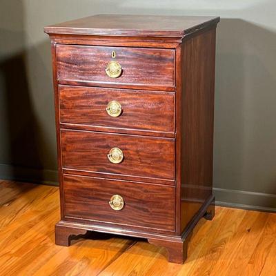 DIMINUTIVE MAHOGANY CHEST | Including 4 graduated drawers with brass pulls showing wreath relief raised on bracket feet. - l. 22 x w. 21...