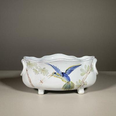 HENRIOT QUIMPER HUMMINGBIRD CENTER BOWL | Footed center bowl with lobed rim, decorated with a humming bird in flight, grasping at an...