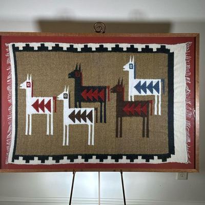FRAMED ALPACA WEAVING | Showing five alpacas on beige background with black and white border. - w. 43 x h. 30 in (frame) 