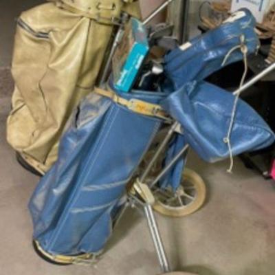 Vintage his and her golf clubs, and only been used twice. 