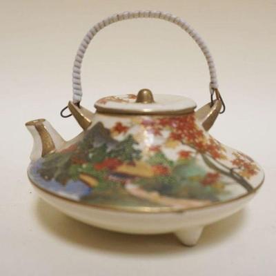1029	SMALL SATSUMA TEAPOT, APPROXIMATELY 2 1/4 IN
