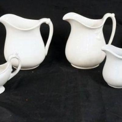1144	7 PIECE IRONSTONE LOT, 2 PITCHERS, TEAPOT, 3 CREAMERS & SQUARE BOWL, TALLEST APPROXIMATELY 10 IN HIGH
