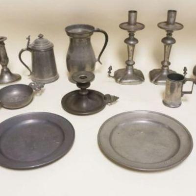1061	LARGE LOT OF ASSORTED ANTIQUE PEWTER INCLUDING CANDLESTICKS, 9 IN PLATES, MEASURES, PORRINGERS
