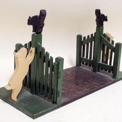 1132	FOLK ART DOG CHASING CAT ON FENCE POST BOOKENDS, APPROXIMATELY 6 IN X 15 IN X 9 IN HIGH
