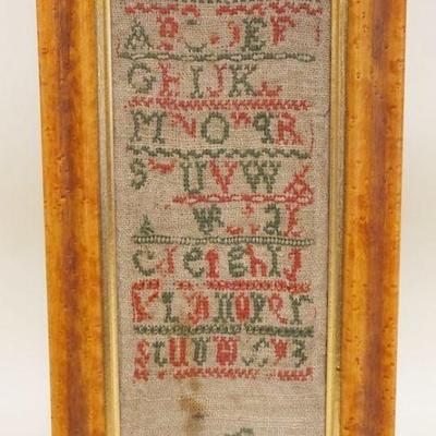 1169	ANTIQUE SAMPLER IN BIRDSEYE MAPLE FRAME, WEAR TO SAMPLER, APPROXIMATELY 6 1/2 IN X 12 IN OVERALL
