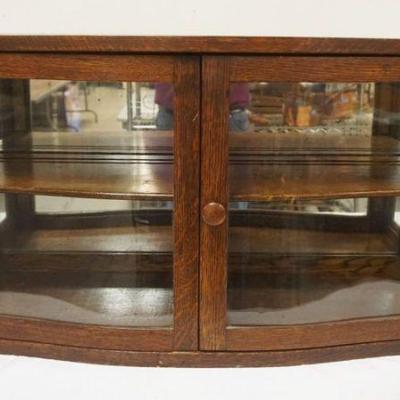 1319	OAK MIRROR BACK SERPENTINE FRONT COUNTER TOP DISPLAY CASE, APPROXIMATELY 35 IN X 13 IN X 18 IN HIGH
